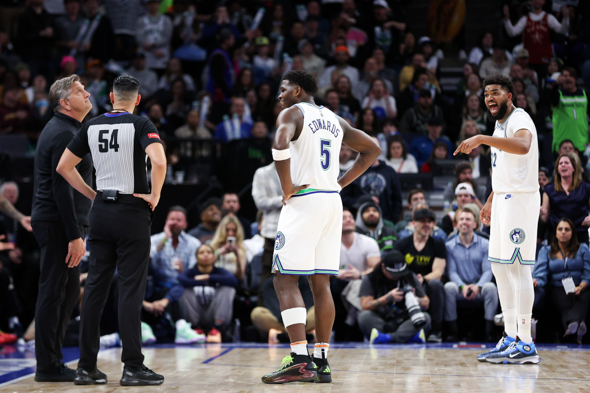 Feb 23, 2024; Minneapolis, Minnesota, USA; Minnesota Timberwolves center Karl-Anthony Towns (32) argues after he was charged with a foul against the Milwaukee Bucks during the second half at Target Center. Mandatory Credit: Matt Krohn-USA TODAY Sports